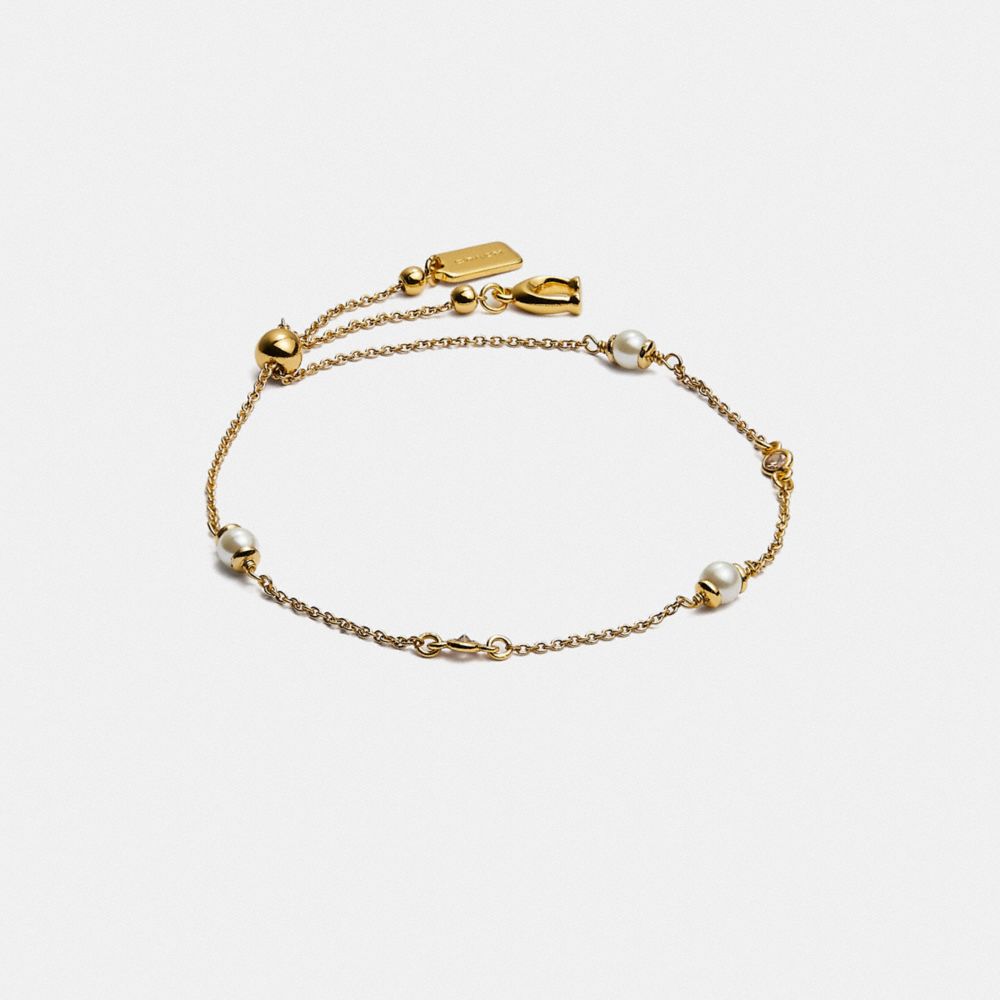 Pulsera COACH® Classic Crystal Pearl Slider Mujer Doradas | COSGI556